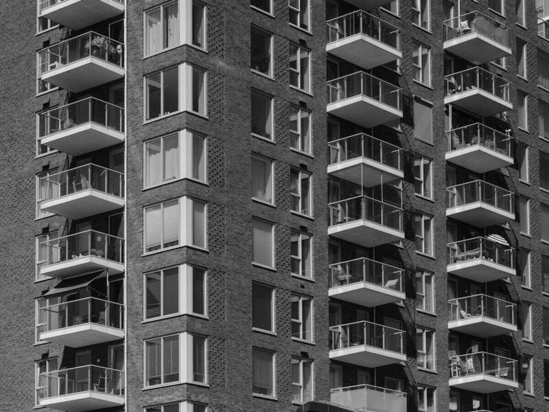 Investor reviewing blanket loan documents for multiple rental properties