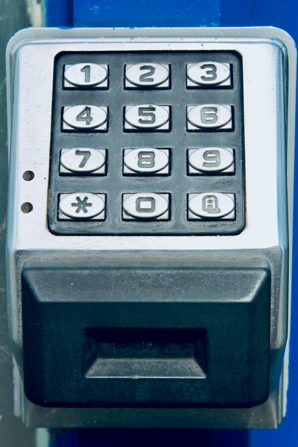 Smart lock keypad on a rental property door providing keyless entry for tenants