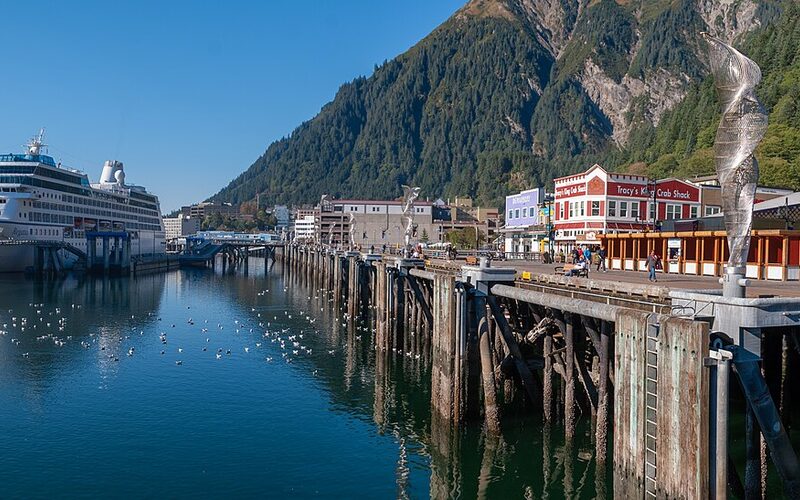 Juneau, Alaska capital city with cruise ships in port and mountains behind