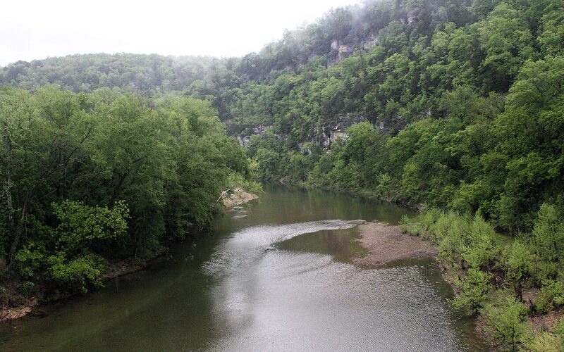 Buffalo National River winding beneath limestone bluffs in the Ozark Mountains