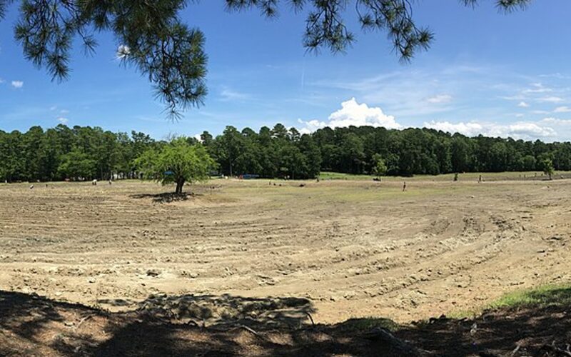 Visitors searching for diamonds in the plowed field at Crater of Diamonds State Park, Arkansas