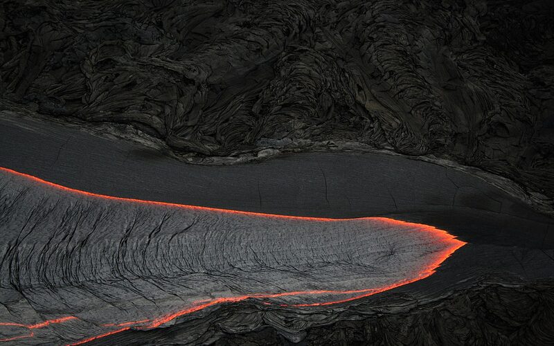 Glowing lava flows at Hawaii Volcanoes National Park on the Big Island