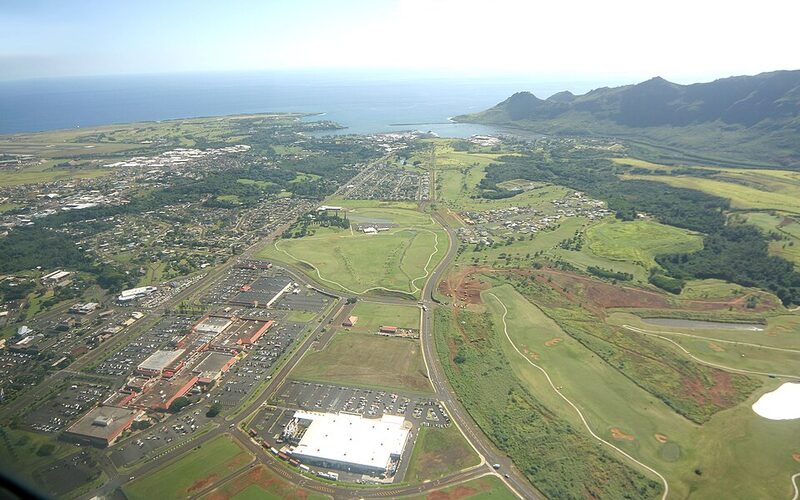 Lihue town center on Kauai with lush green mountains and Nawiliwili Harbor in the background