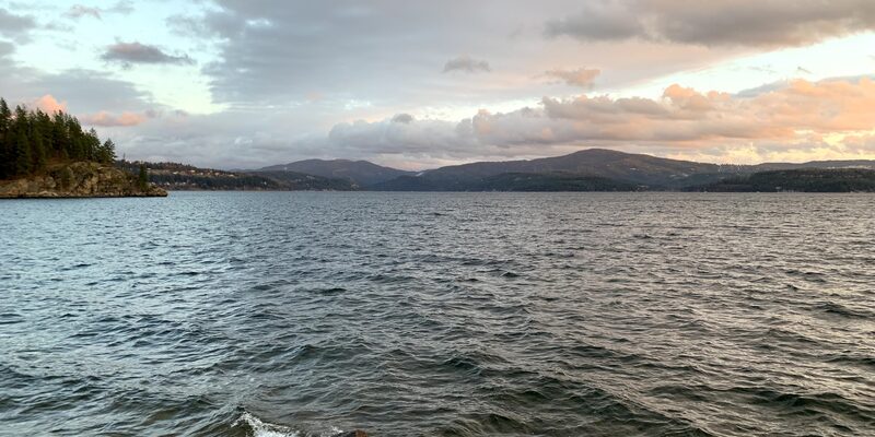 Lake Coeur d'Alene with forested shoreline and mountains in Idaho