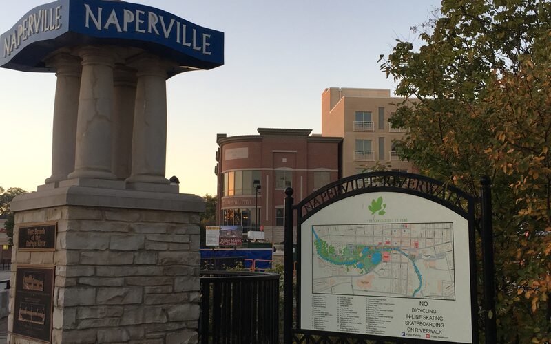 Naperville Riverwalk and downtown Water Street at sunrise along the DuPage River