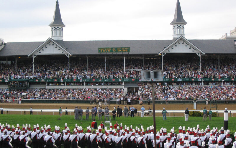 Churchill Downs grandstand with iconic twin spires and packed crowd during Kentucky Derby in Louisville