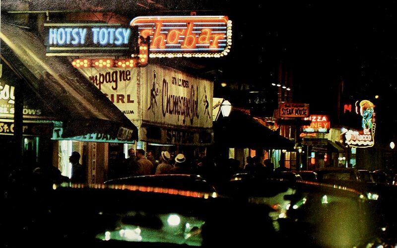Vintage neon signs along Bourbon Street in the French Quarter, New Orleans