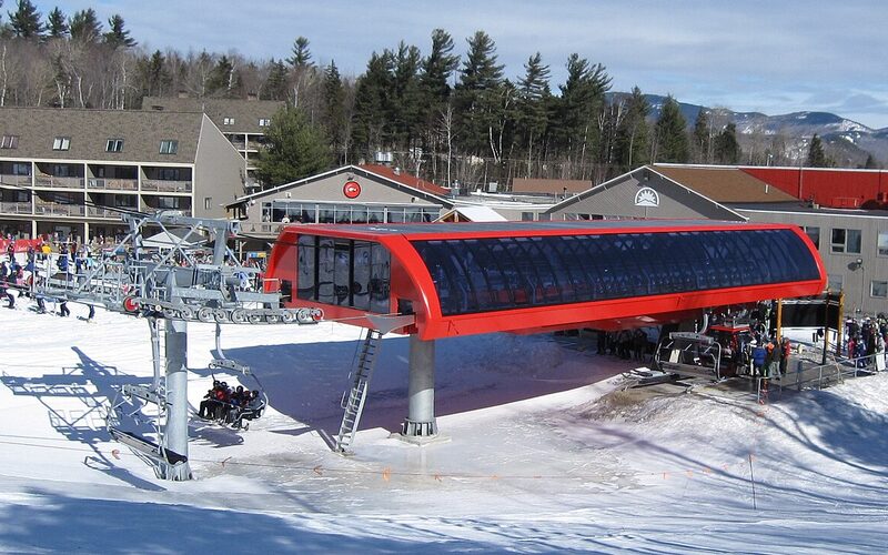 Sunday River ski resort with snow-covered slopes and mountain lodge in western Maine