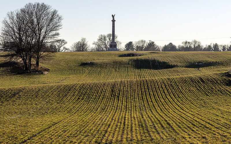 Antietam National Battlefield with rolling green fields and historic fences