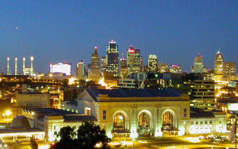 Kansas City skyline at sunset with the Liberty Memorial and Union Station in the foreground