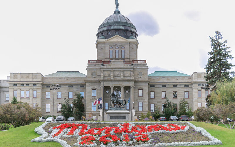 Montana State Capitol building in Helena with copper dome, Lady Liberty statue, and Thomas Meagher equestrian statue