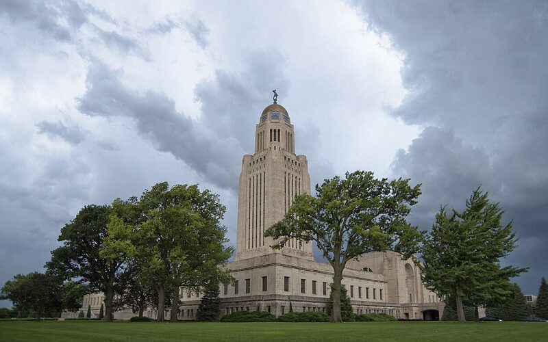 Nebraska State Capitol tower rising above downtown Lincoln