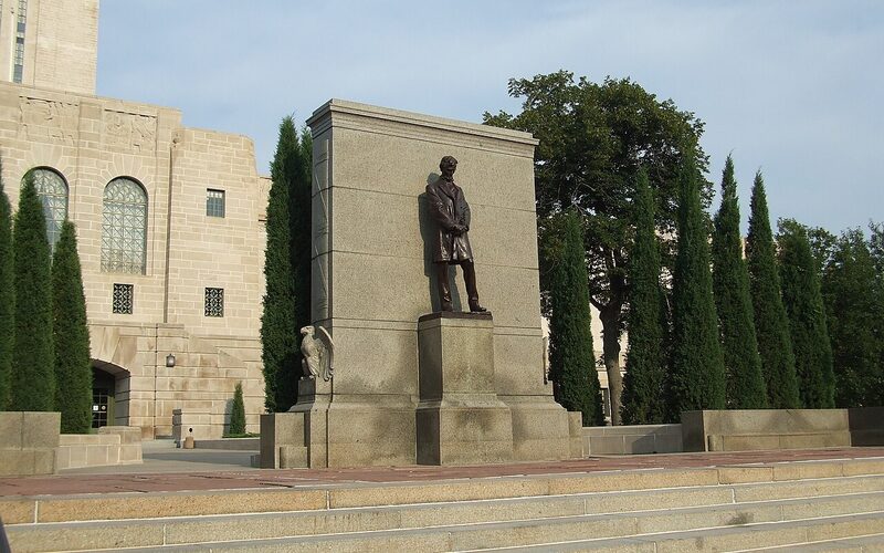 Abraham Lincoln statue in front of the Nebraska State Capitol tower in Lincoln