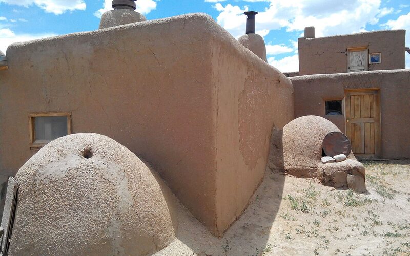 Traditional adobe structures and horno ovens at Taos Pueblo, New Mexico