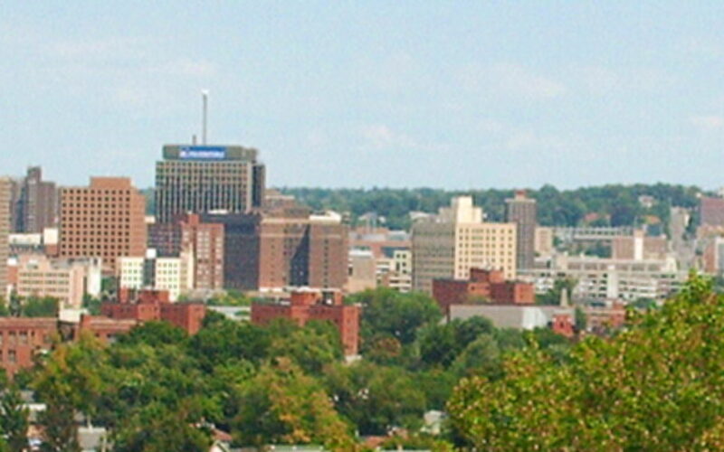Syracuse, New York skyline with downtown buildings and surrounding hills