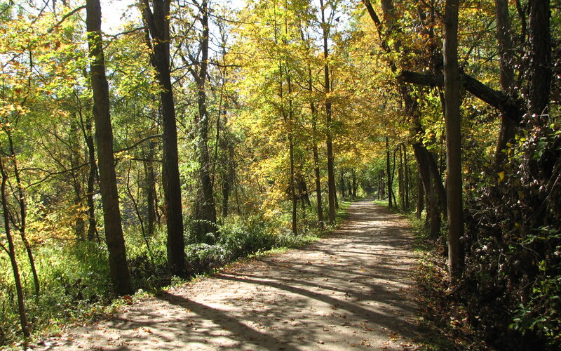 Ohio and Erie Canal Towpath Trail winding through autumn trees in Cuyahoga Valley National Park