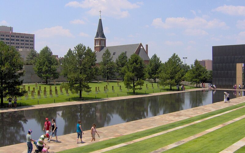 Oklahoma City National Memorial reflecting pool with the Field of Empty Chairs and Gates of Time