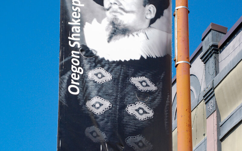 Oregon Shakespeare Festival banner on a street pole in Ashland, Oregon