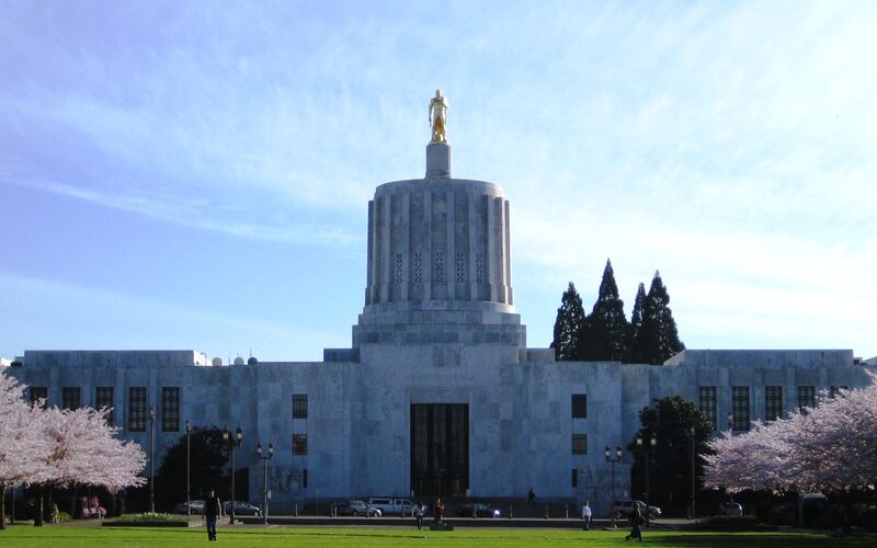Oregon State Capitol building in Salem with its distinctive gold Oregon Pioneer statue