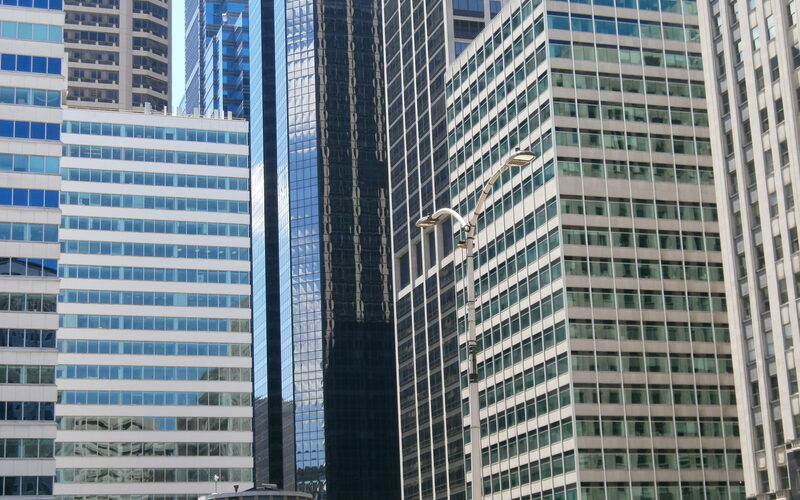 Philadelphia skyline featuring City Hall, the Comcast Center, and the Schuylkill River at sunset