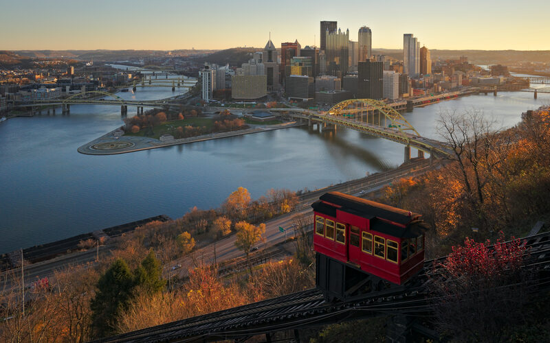 Pittsburgh skyline at the confluence of the Allegheny, Monongahela, and Ohio rivers with the Fort Pitt Bridge