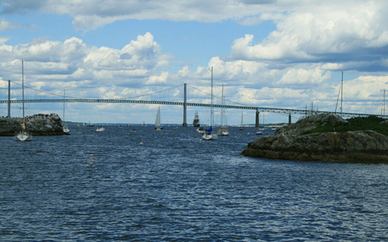 Claiborne Pell Newport Bridge spanning Narragansett Bay with sailboats in Rhode Island