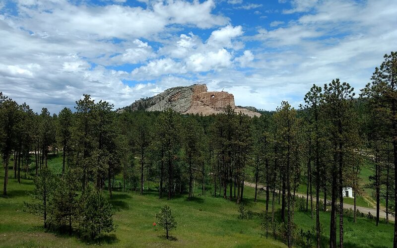 Crazy Horse Memorial mountain carving in progress with the visitor complex in the foreground in the Black Hills of South Dakota