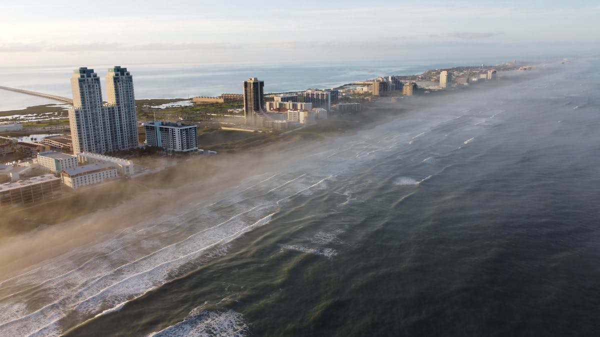Aerial view of South Padre Island beachfront with high-rise condos