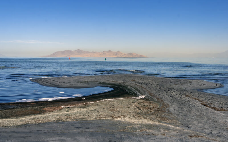 Shore-level view of the Great Salt Lake with mountains in the distance, Utah