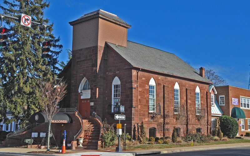 Manassas historic downtown with Civil War battlefield park and surrounding suburban development
