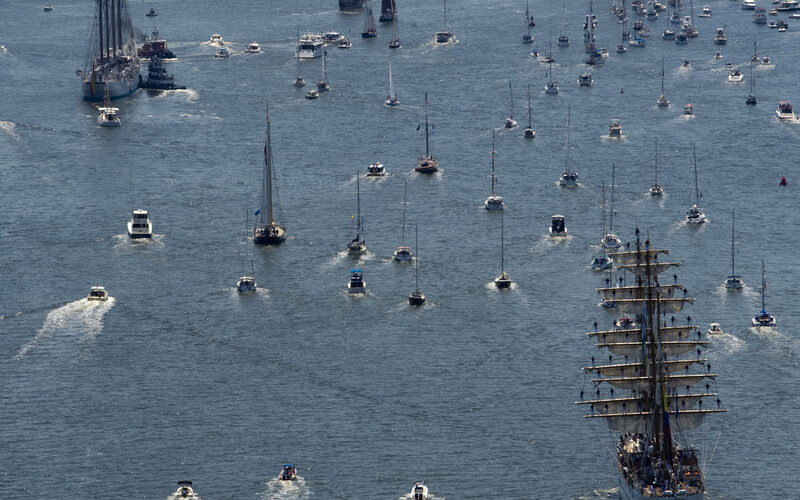Norfolk harbor during a tall ship event with boats and crowds