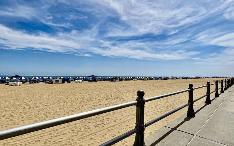 Virginia Beach boardwalk and sandy beach with beachgoers