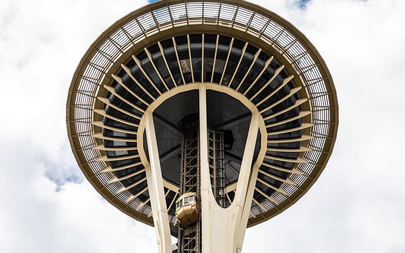 Close-up view looking up at the Space Needle observation deck in Seattle