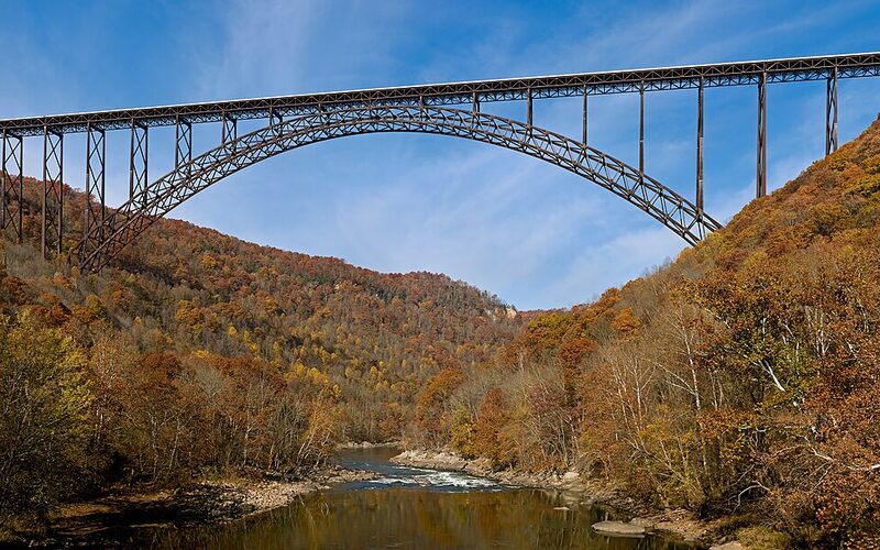 New River Gorge Bridge spanning the deep river canyon with fall foliage in West Virginia