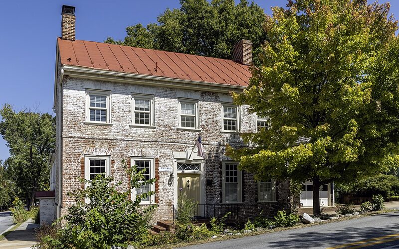 Shepherdstown West Virginia historic German Street with Shepherd University campus and Potomac River bridge