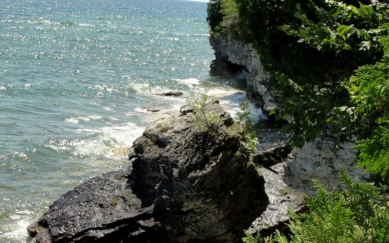 Rugged limestone coastline at Cave Point County Park in Door County, Wisconsin, along Lake Michigan